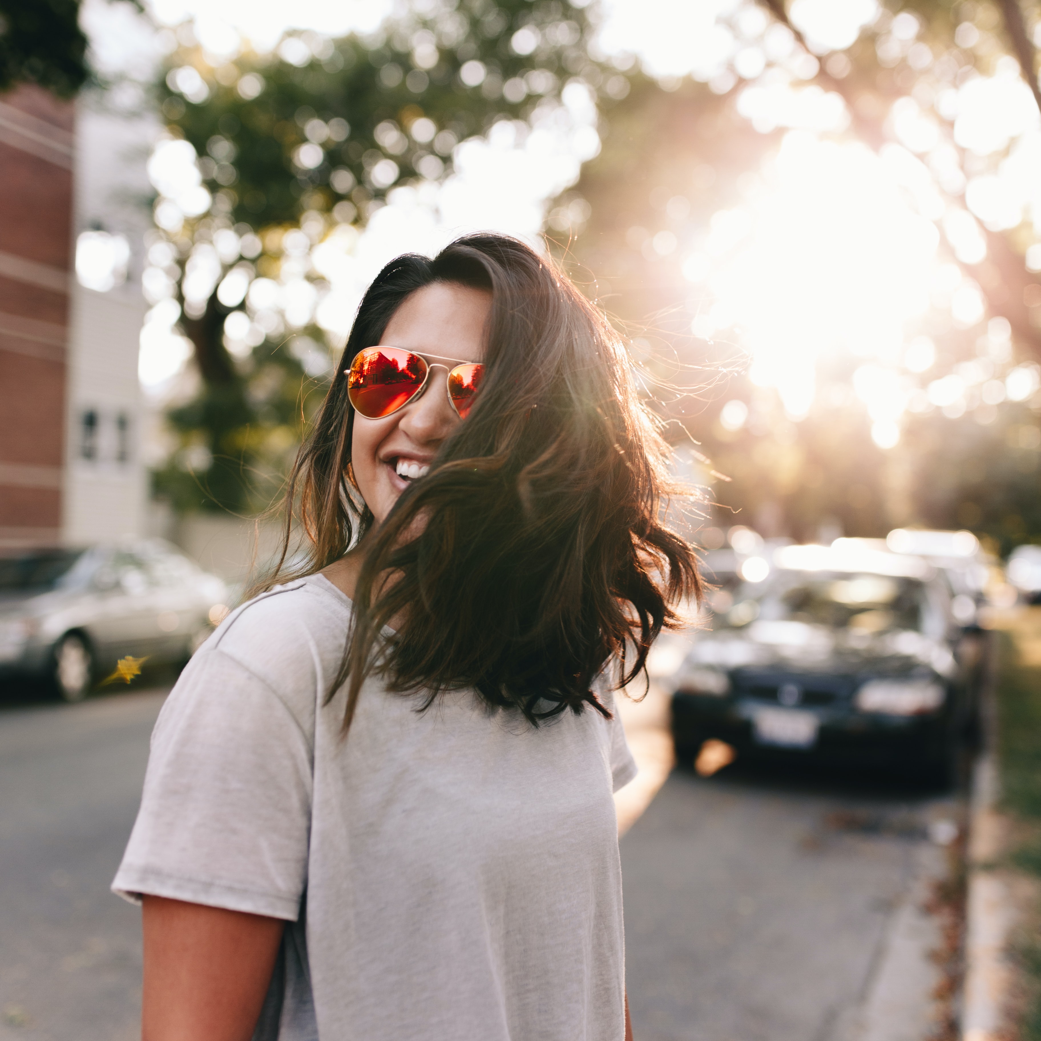 woman wearing sunglasses outside in the street